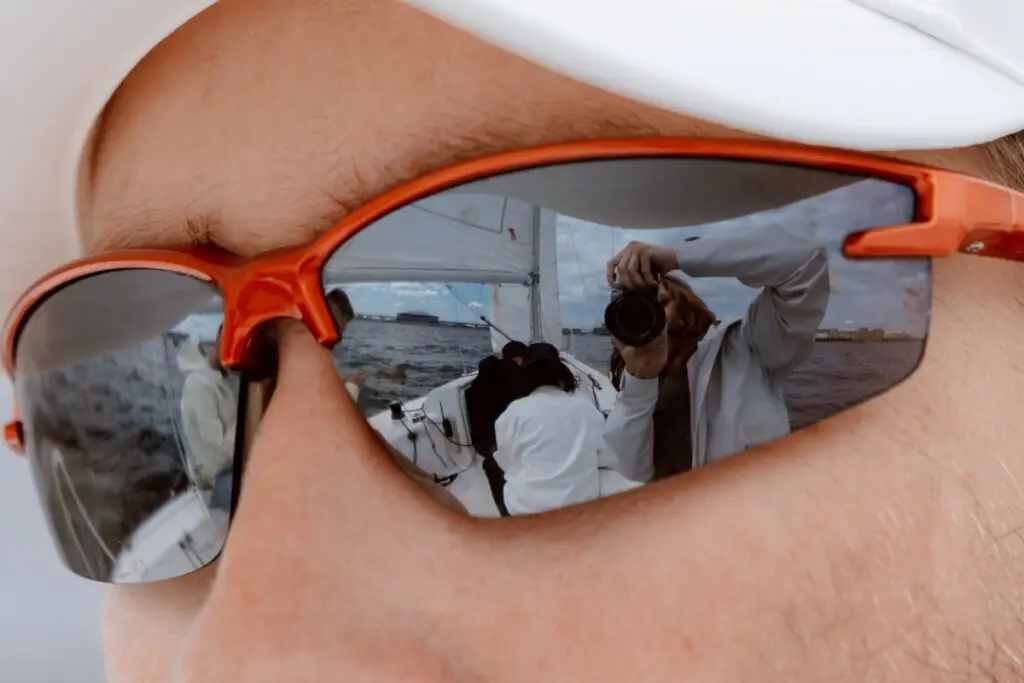 close up photo of man wearing sunglasses on a boat