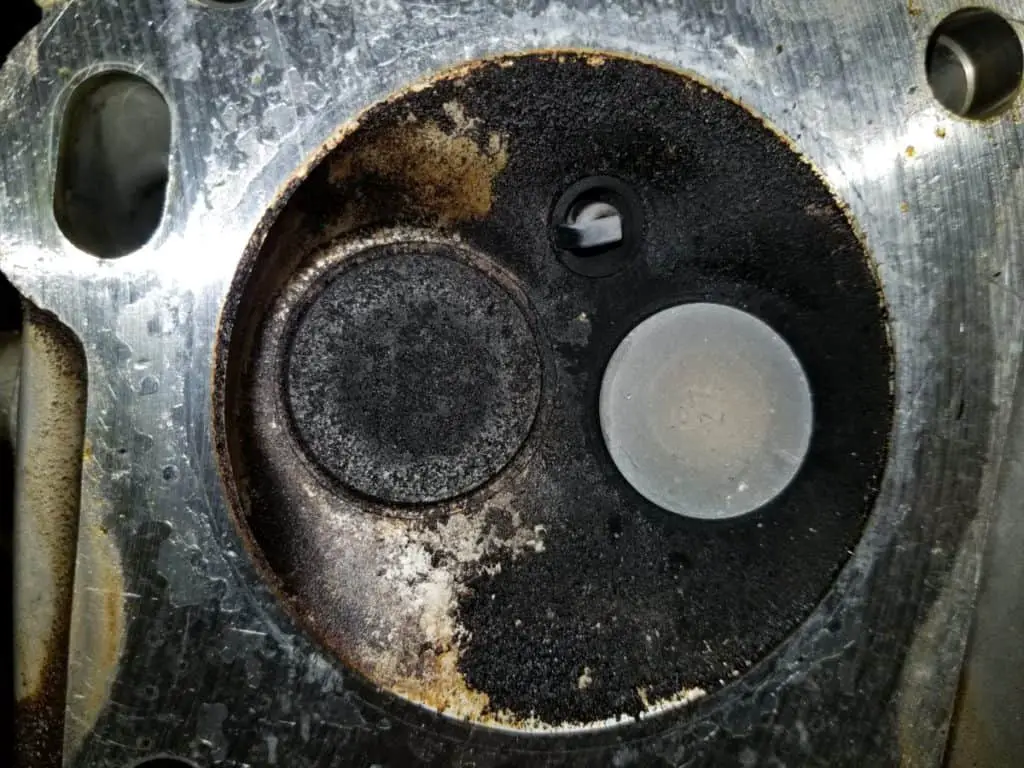 image showing excessive carbon buildup that can damage a boat cylinder