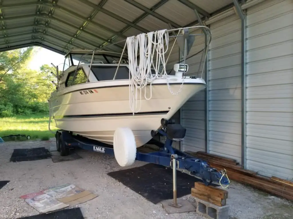image of a cuddy cabin on a boat trailer ready to be hitched to a truck for towing.