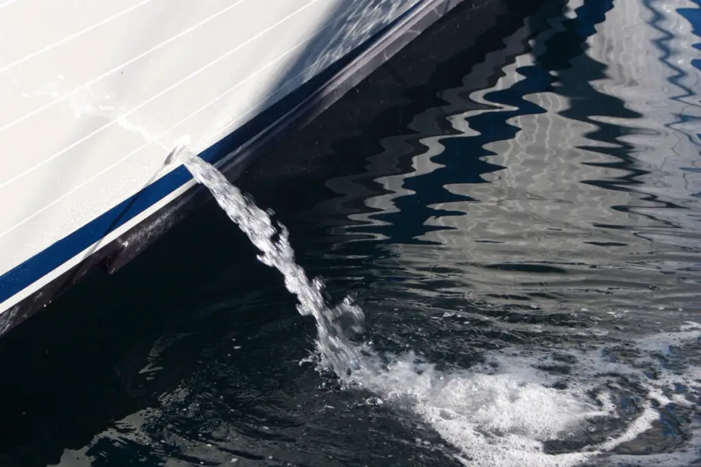 water being pumped out of a boat's bilge