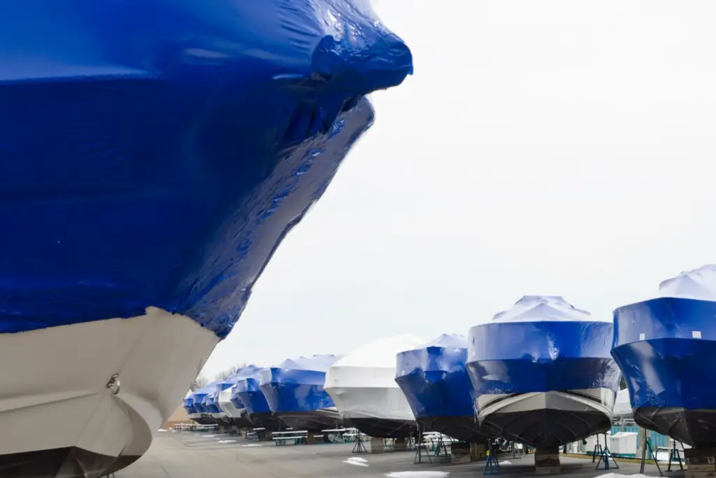 image of cuddy cabins that are shrink wrapped for winter storage