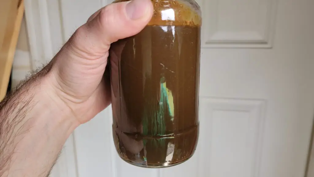 image of oil from the author's boat engine that looks like a chocolate milkshake