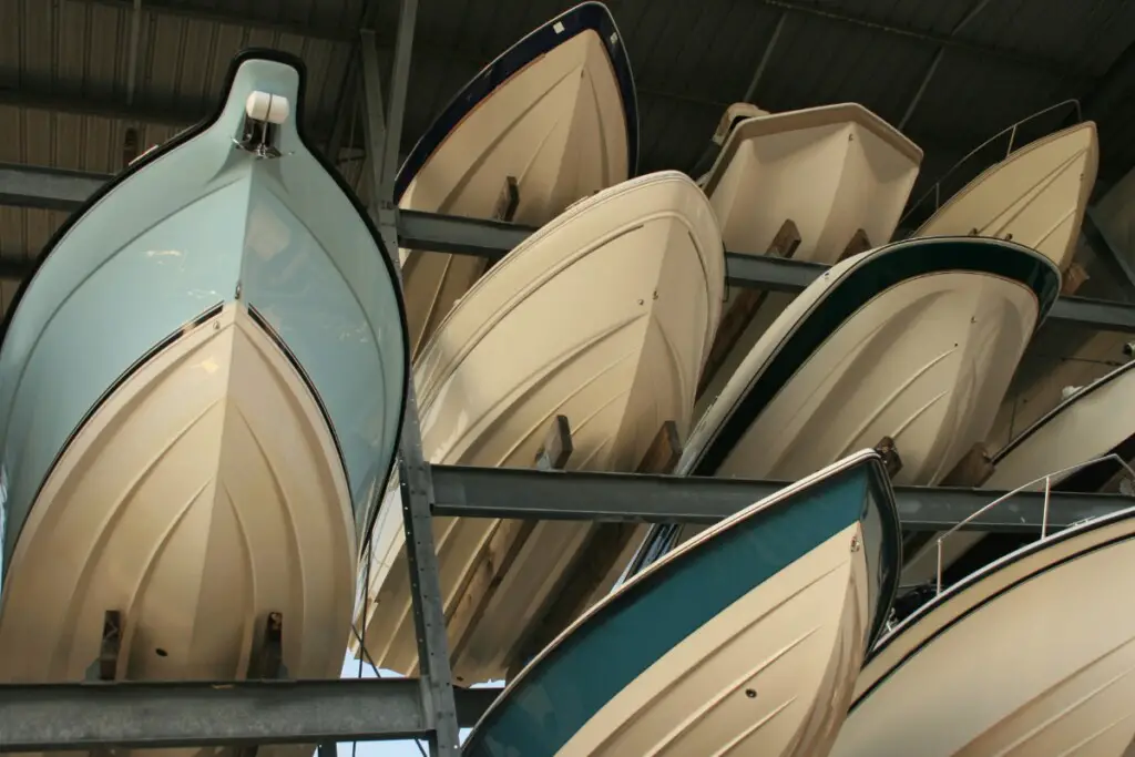 image of lots of boats being stored on a dry rack for the winter