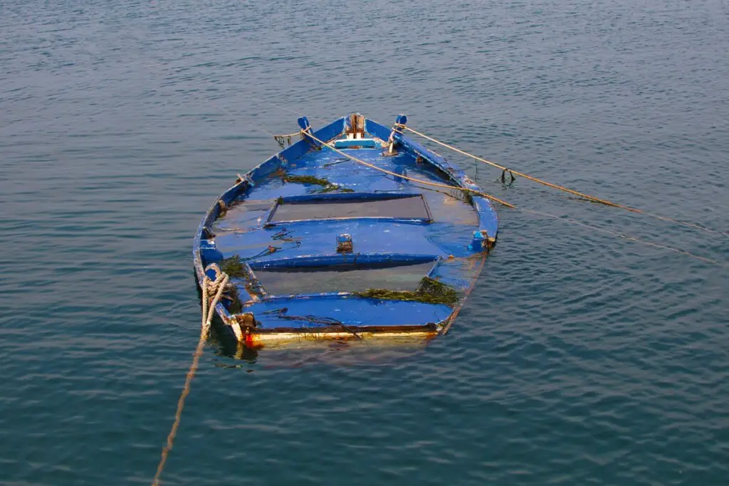 image of a boat that sank from water that took over the bilge