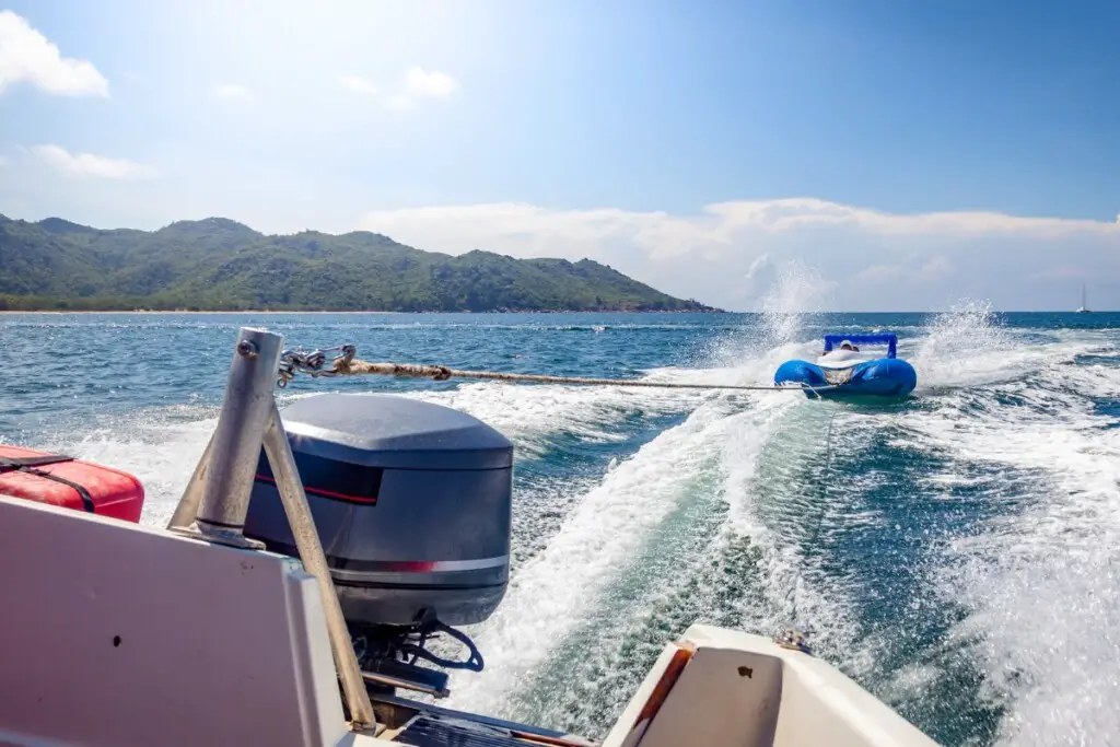 image of a boat on plane with the wake behind them.